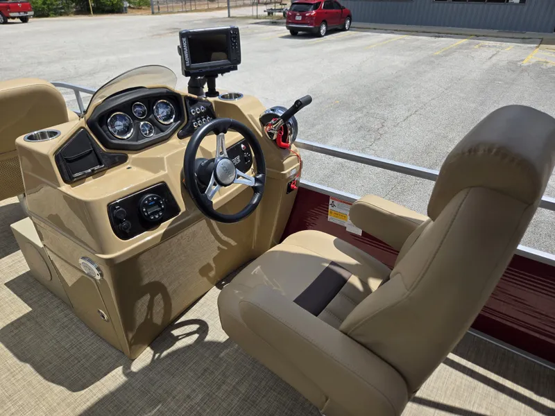 Slide: The Image of The image shows the cockpit of a 2020 Lowe SF 232 with a beige helm and comfortable seat. - 17