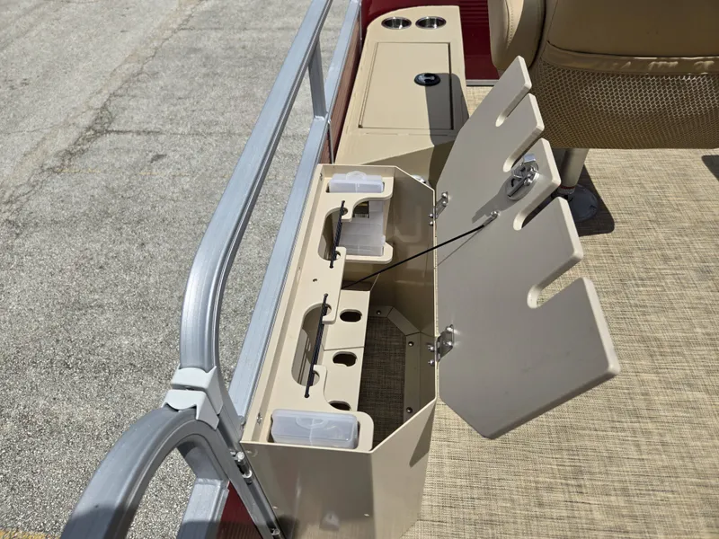 Slide: The Image of An open storage compartment on a boat with slots and holders. - 16