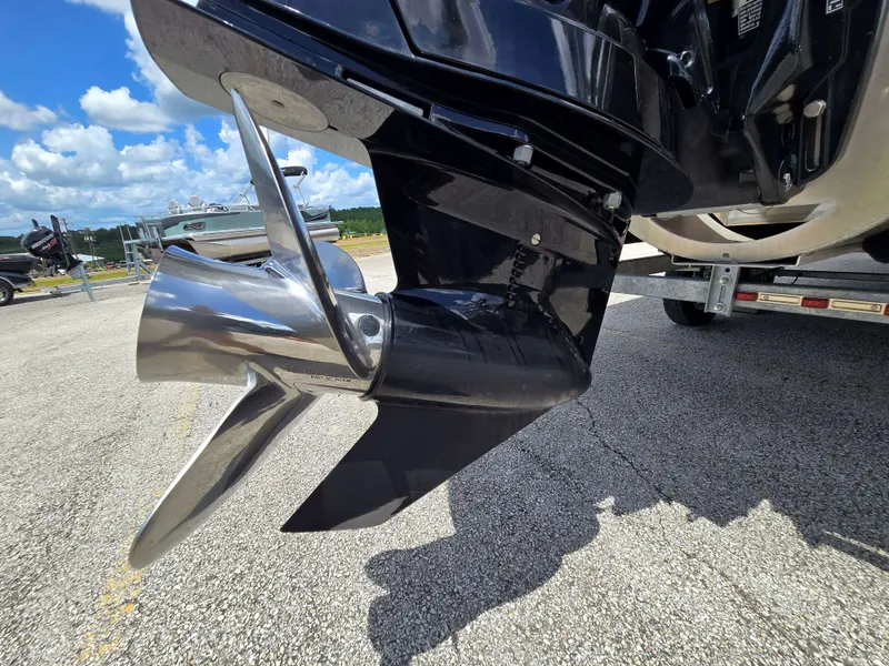 Slide: The Image of Close-up of a shiny propeller on a boat on a trailer, with blue sky in the background. - 29