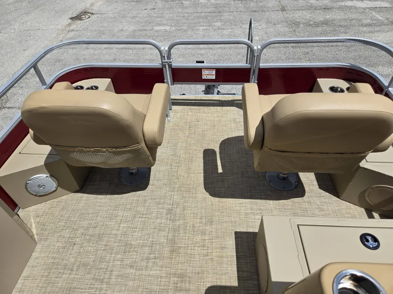 Slide: The Image of The image shows the deck of a 2020 Lowe SF 232 pontoon boat with two beige seats. - 11