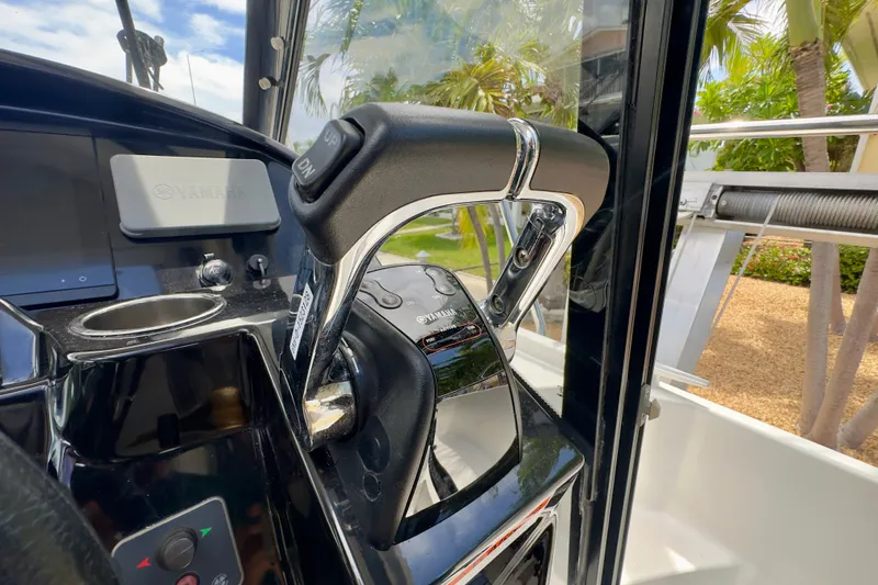 Slide: The Image of Close-up of 2018 Jeanneau NC 895 boat throttle control in cockpit. - 25