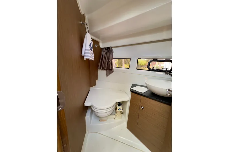 Slide: The Image of Interior of 2018 Jeanneau NC 895 boat bathroom with modern fixtures and wood accents. - 29