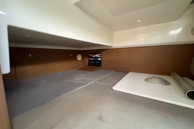 Slide: The Image of Interior cabin of 2018 Jeanneau NC 895 boat, featuring wood paneling and modern design. - 30