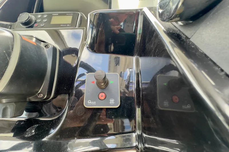 Slide: The Image of Control panel of a 2018 Jeanneau NC 895 boat, featuring navigation equipment. - 26