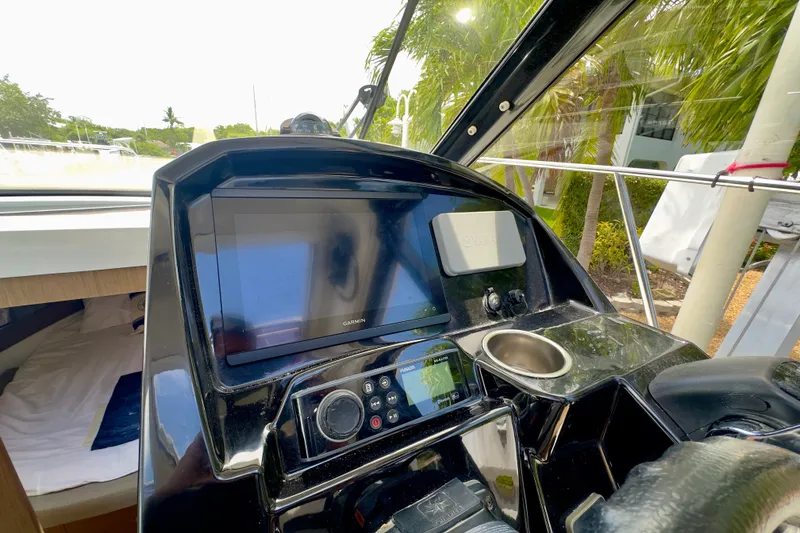 Slide: The Image of Cockpit of 2018 Jeanneau NC 895 boat with navigation equipment and controls. - 24