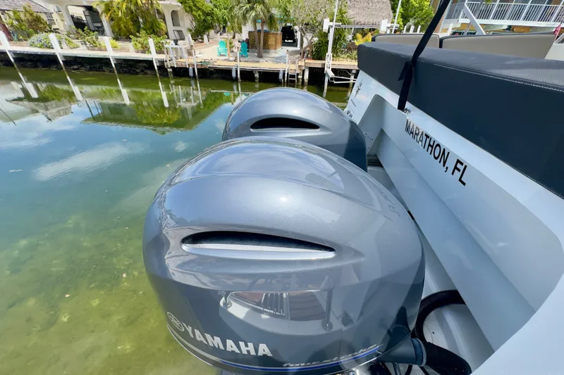 Slide: The Image of Twin Yamaha outboard engines on a 2018 Jeanneau NC 895 boat, docked in Marathon, FL. - 43