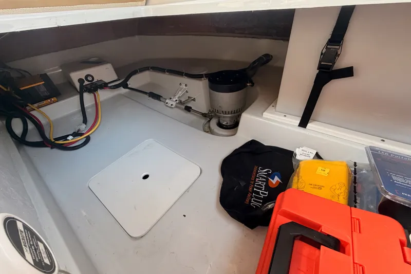 Slide: The Image of Interior of 2018 Duffy Cuddy Cabin 22 boat with equipment and storage items. - 35