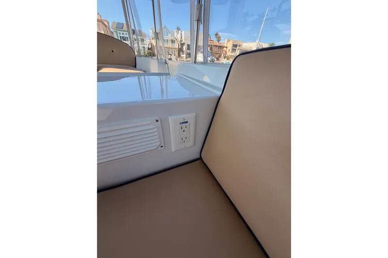 Slide: The Image of Interior of 2018 Duffy Cuddy Cabin 22 boat with seating and power outlet. - 19