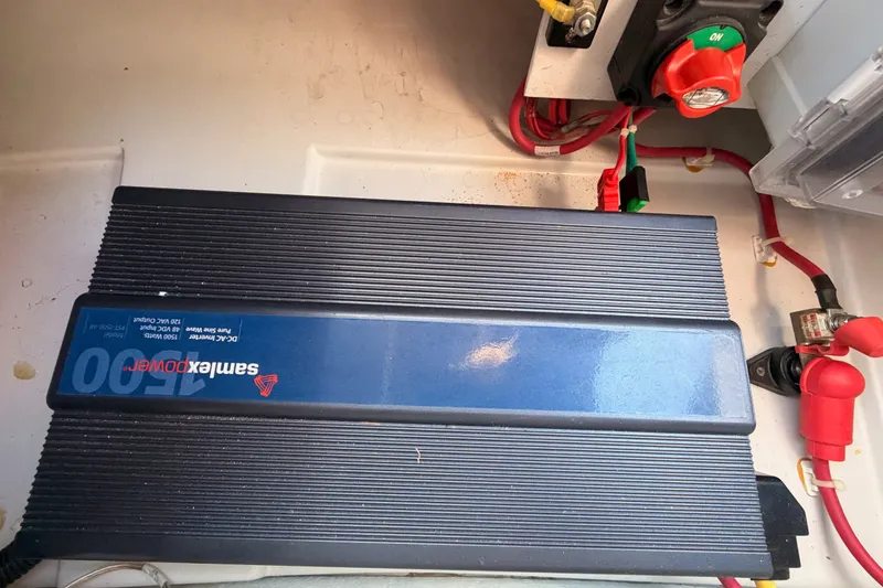 Slide: The Image of SamlexPower inverter in a 2018 Duffy Cuddy Cabin 22 boat, connected with red and black cables. - 41
