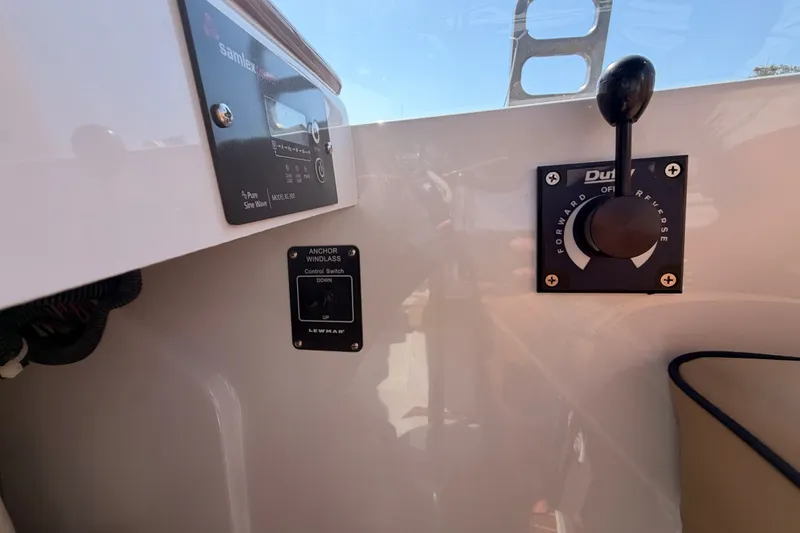 Slide: The Image of Control panel of a 2018 Duffy Cuddy Cabin 22 boat with anchor windlass switch. - 25