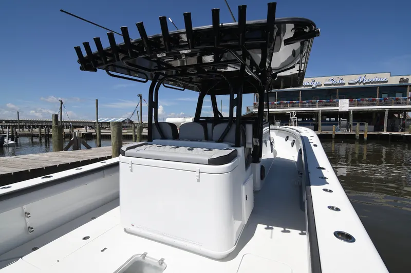 Slide: The Image of 2018 Yellowfin 39 Offshore boat docked at marina under clear blue sky. - 16