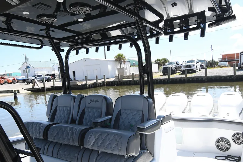 Slide: The Image of 2018 Yellowfin 39 Offshore boat interior with luxurious seating and waterfront view. - 14