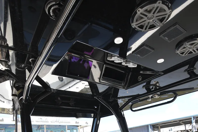 Slide: The Image of 2018 Yellowfin 39 Offshore boat interior with speakers and electronic panel. - 17