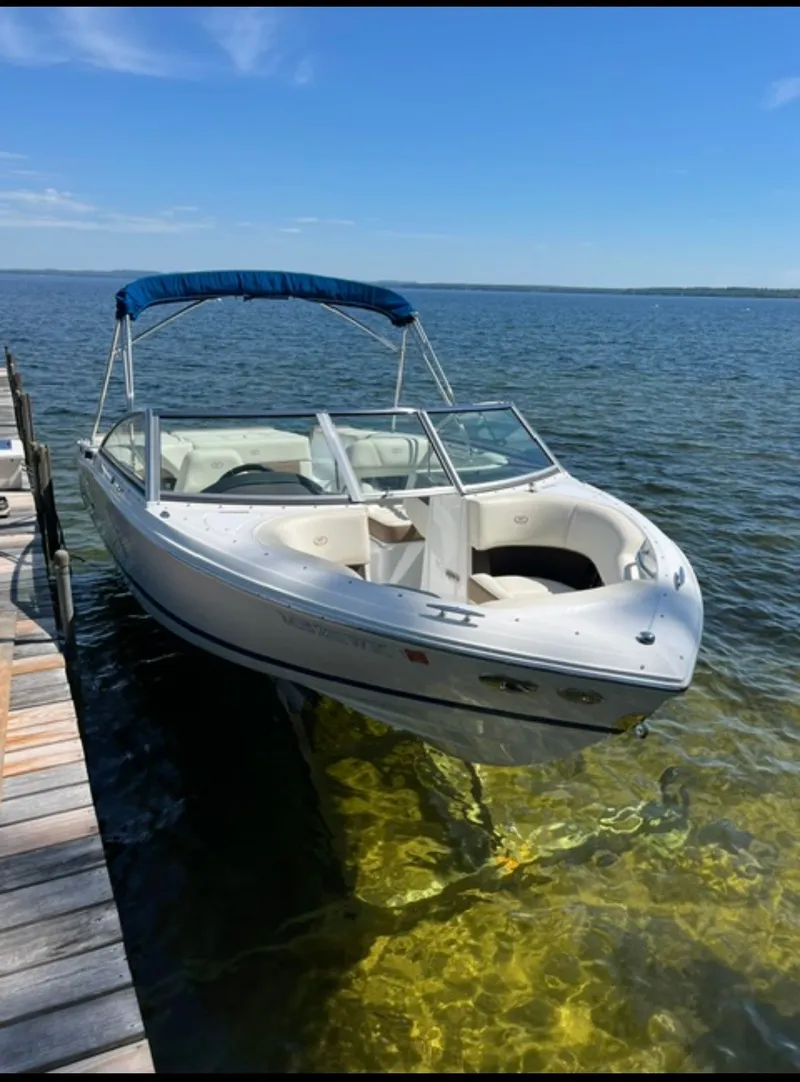 The Image of A white 2017 Cobalt 200S boat docked in clear water under a blue sky. - 10