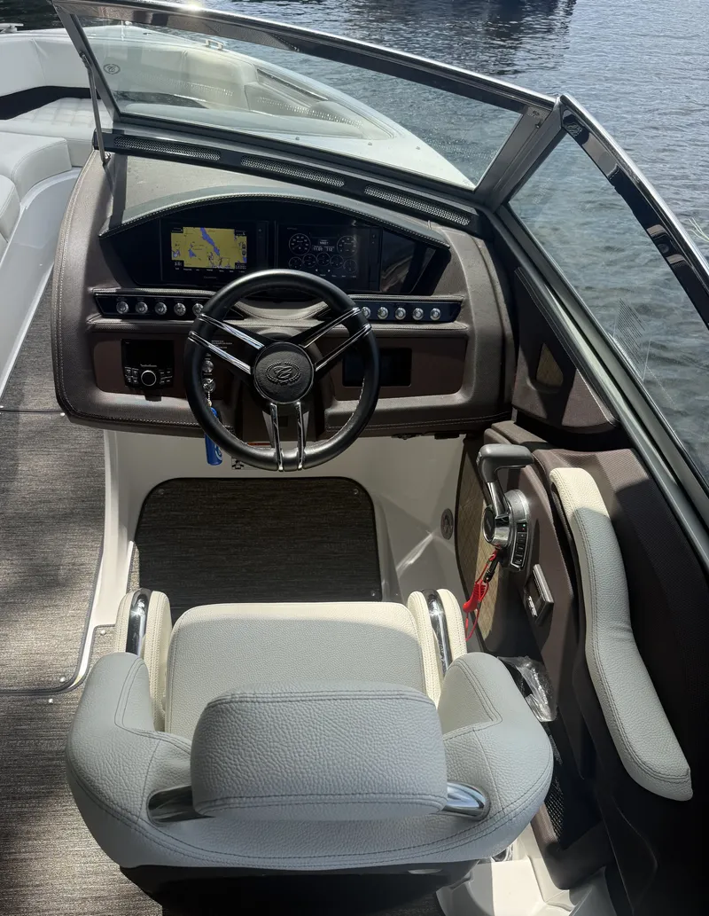 Slide: The Image of The image shows the cockpit of a 2021 Cobalt R3 boat with a modern helm. - 1