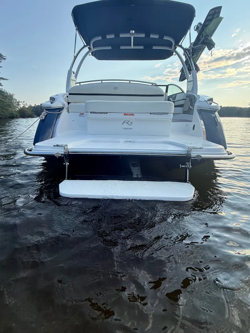 Slide: The Image of A 2021 Cobalt R3 boat with a large swim platform in the water. - 9