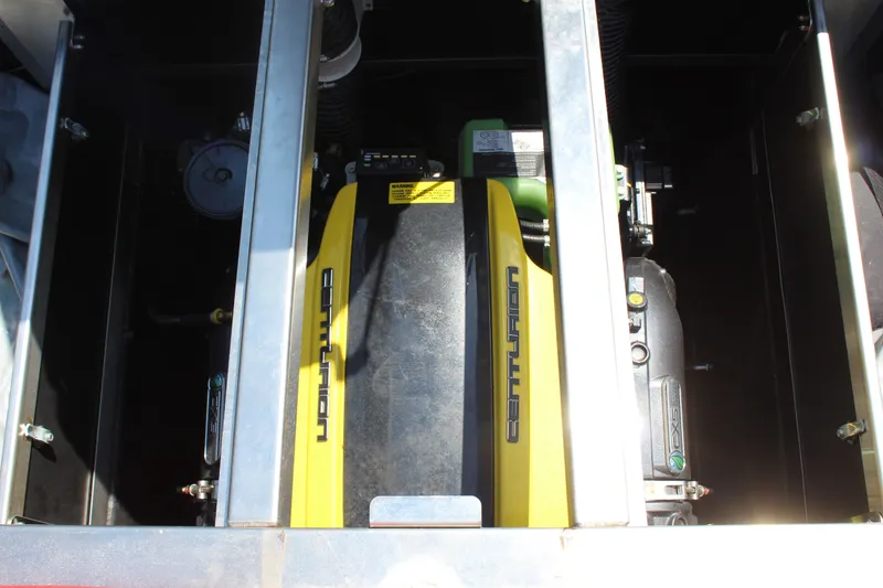 Slide: The Image of The engine compartment of a 2022 Centurion Ri 265 features a powerful engine with yellow accents. - 20