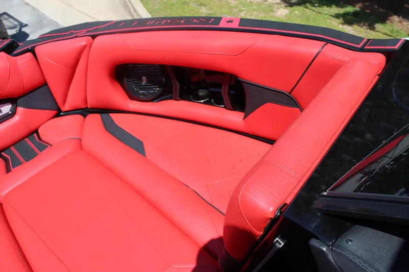 Slide: The Image of Red leather seating in the 2022 Centurion Ri 265, featuring black accents and speakers. - 18