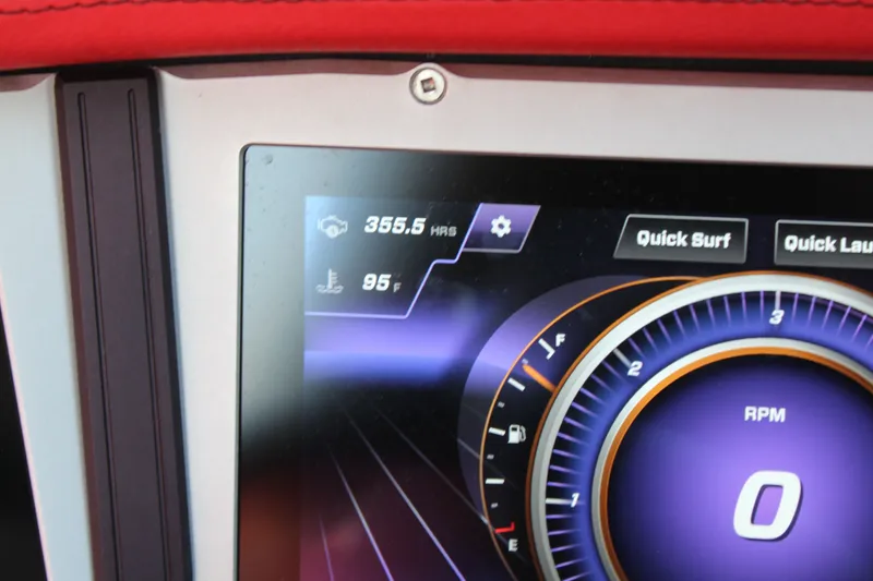 Slide: The Image of Close-up of a digital dashboard with RPM gauge and settings. - 19