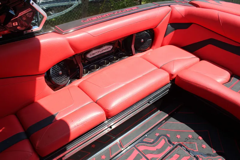Slide: The Image of The image shows the luxurious red interior of a 2022 Centurion Ri 265. - 14