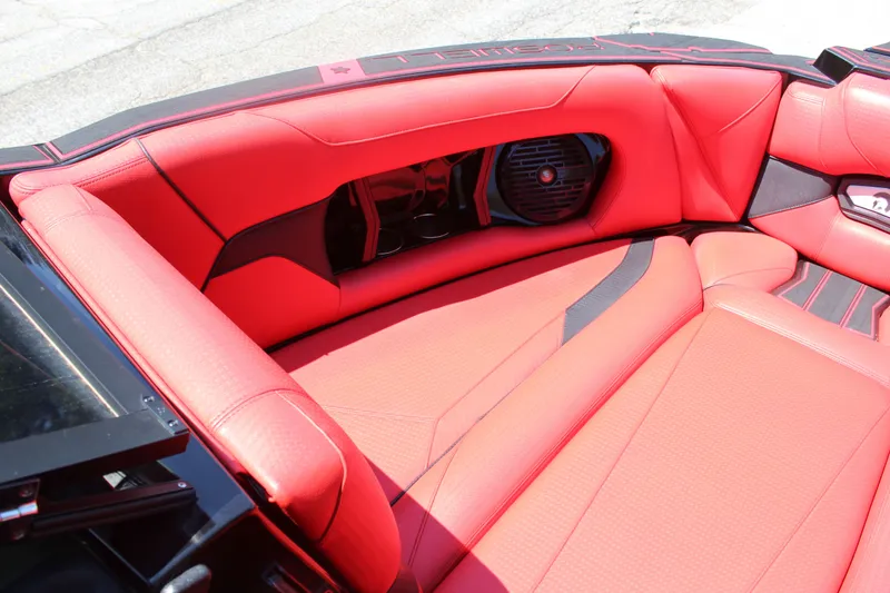 Slide: The Image of The image shows the red, luxurious interior of a 2022 Centurion Ri 265 boat. - 17