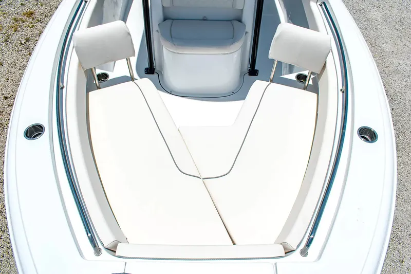 Slide: The Image of The 2027 Sea Hunt Ultra 219 features a sleek, modern design with comfortable seating cushions. - 19