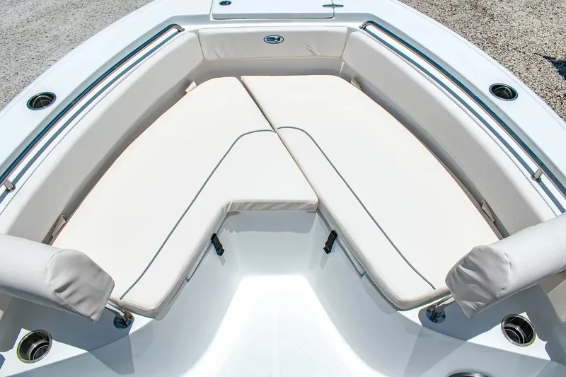 Slide: The Image of The 2027 Sea Hunt Ultra 219 features a spacious, cushioned seating area at the bow. - 24