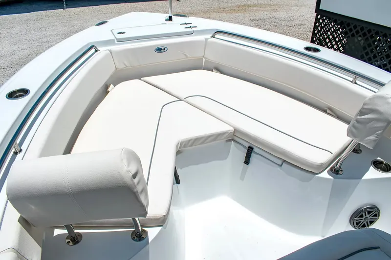 Slide: The Image of The 2027 Sea Hunt Ultra 219 features a spacious, cushioned seating area at the bow. - 25