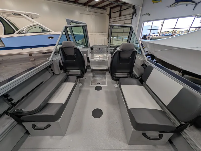 Slide: The Image of Interior of a 2026 Smoker Craft Phantom 20 X2 with gray seating and modern design. - 27