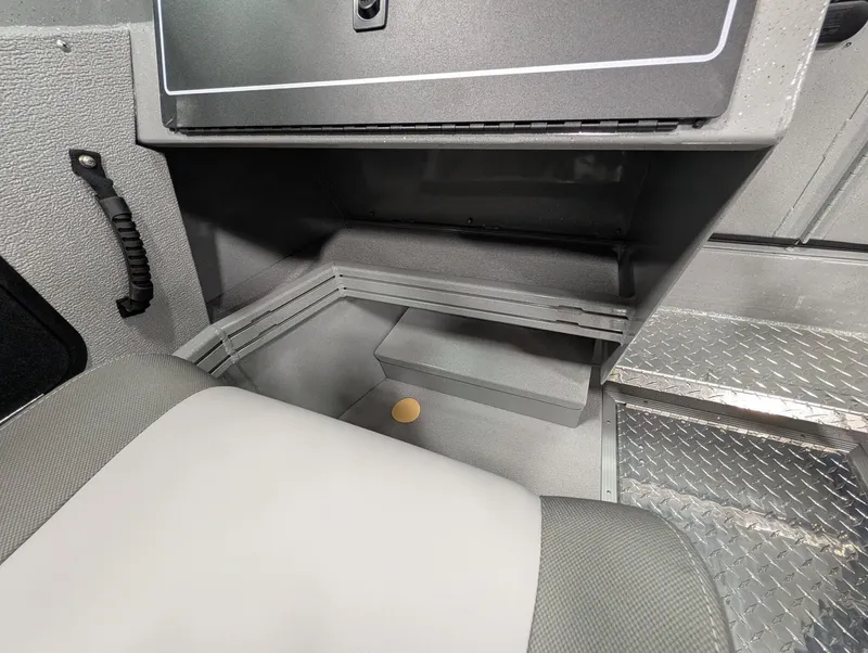 Slide: The Image of Interior of a 2026 Smoker Craft Phantom 20 X2 with gray upholstery and metal flooring. - 34