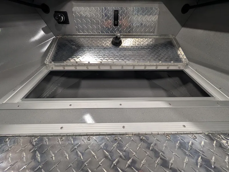 Slide: The Image of The image shows the interior of a Smoker Craft Phantom 20 X2 with aluminum diamond plate flooring. - 31