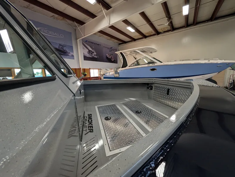 Slide: The Image of Interior view of a 2026 Smoker Craft Phantom 20 X2 in a showroom. - 19