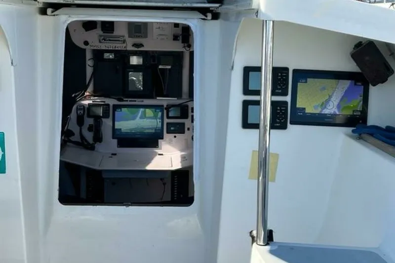 Slide: The Image of Cockpit of 2007 Class 40 Akilaria MK1 sailboat with navigation equipment. - 25