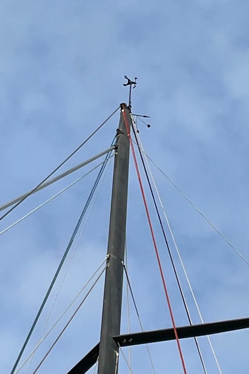 Slide: The Image of Mast of 2007 Akilaria MK1 Class 40 yacht against blue sky. - 20