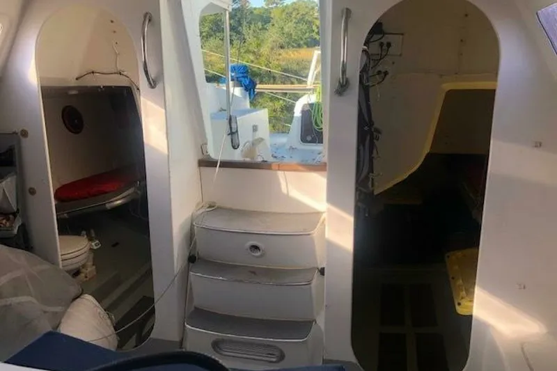 Slide: The Image of Interior view of 2007 Akilaria MK1 sailboat, featuring compact cabin spaces and storage. - 22