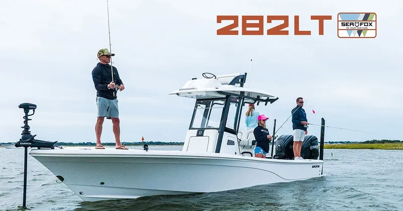 The Image of Three people are fishing on a Sea Fox 282 Hybrid LT boat in calm waters. - 1