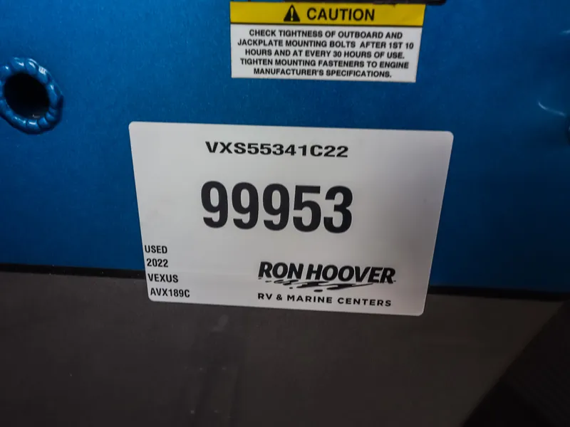 Slide: The Image of Label on a 2022 Vexus AVX189C boat with serial number and dealer information. - 23