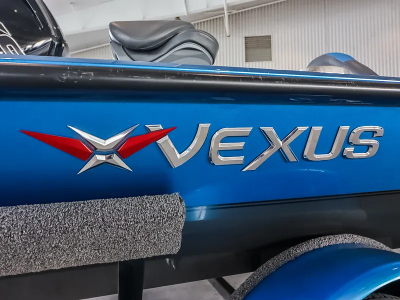Slide: The Image of Close-up of the Vexus logo on a blue boat hull. - 19
