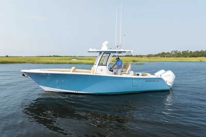 The Image of 2024 Sportsman Open 262 Center Console boat on calm water, side view. - 0
