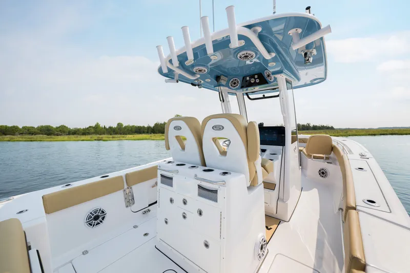 Slide: The Image of 2024 Sportsman Open 262 Center Console boat interior on calm water. - 21