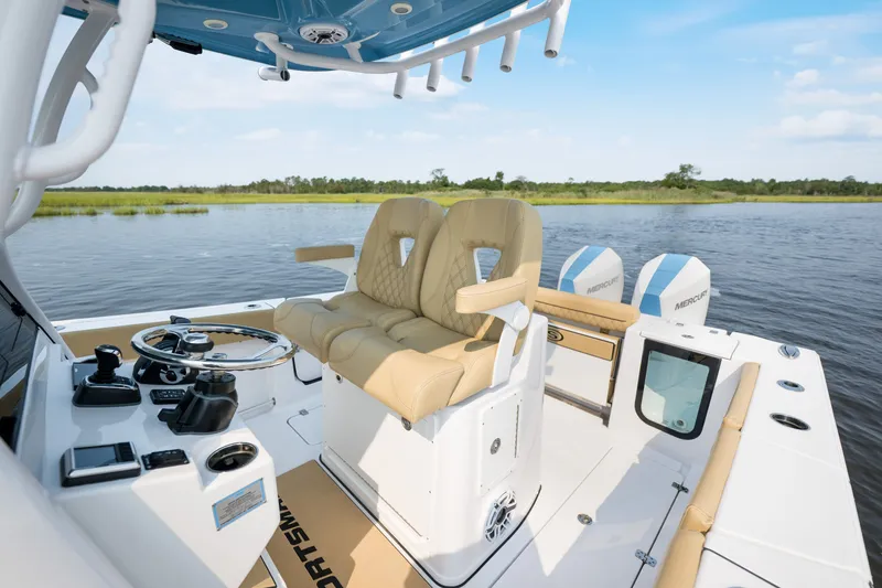 Slide: The Image of 2024 Sportsman Open 262 Center Console boat interior with dual seats and steering wheel. - 15