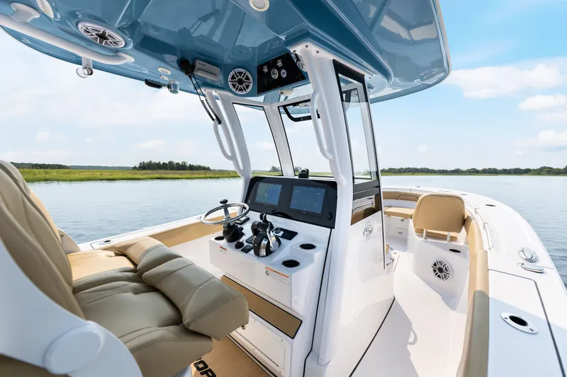 Slide: The Image of 2024 Sportsman Open 262 Center Console boat interior with modern helm and seating. - 14