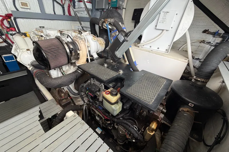 Slide: The Image of Engine room of a 2018 Regal 53 Sport Coupe, showcasing mechanical components and systems. - 63