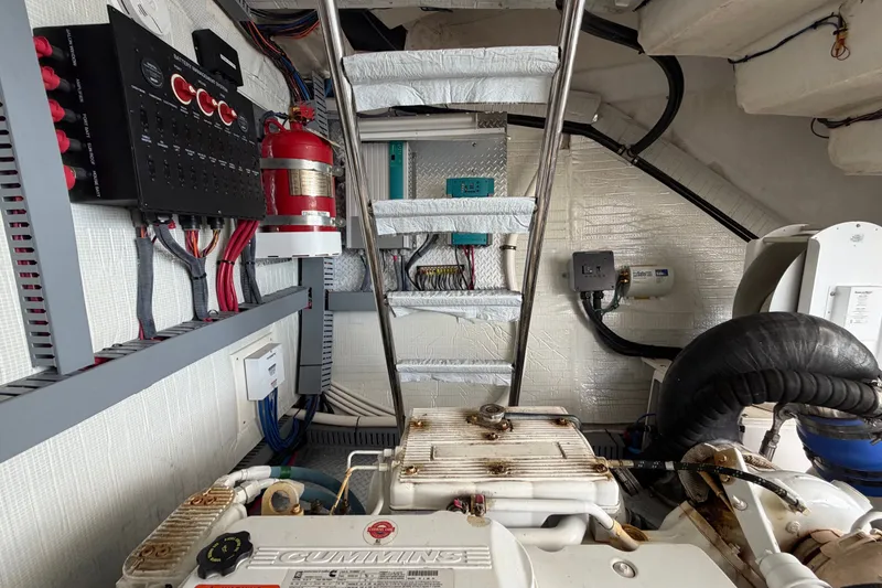Slide: The Image of Engine room of 2018 Regal 53 Sport Coupe with Cummins engine and control panel. - 53