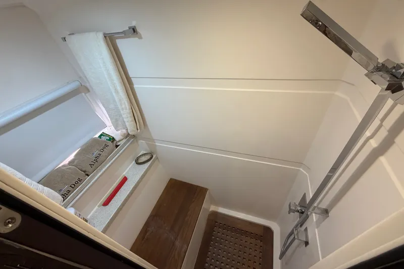 Slide: The Image of Shower area in 2018 Regal 53 Sport Coupe yacht with modern fixtures. - 107