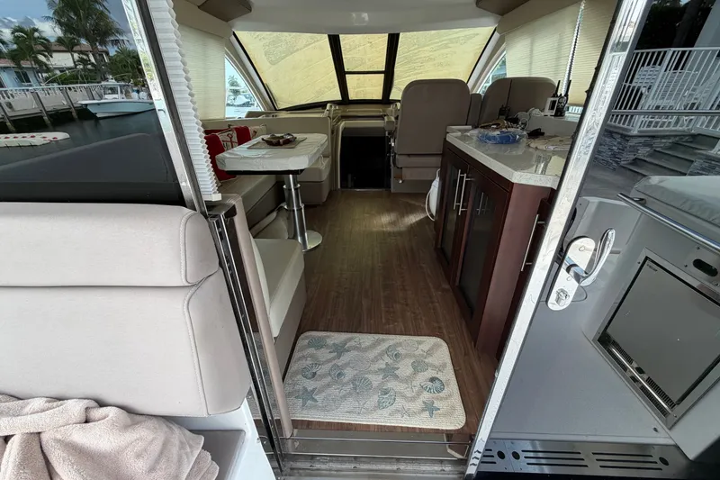 Slide: The Image of Interior view of a 2018 Regal 53 Sport Coupe yacht, featuring a modern cabin design. - 68