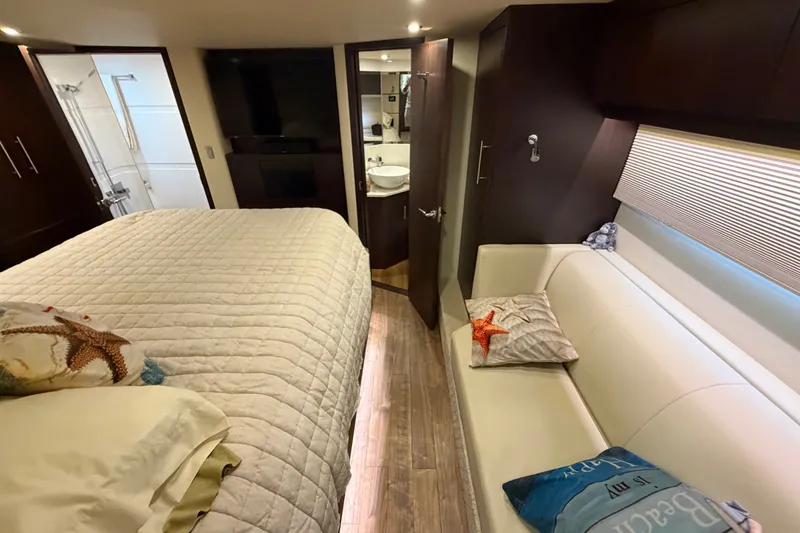 Slide: The Image of Luxurious interior of 2018 Regal 53 Sport Coupe yacht with bed, sofa, and bathroom. - 110