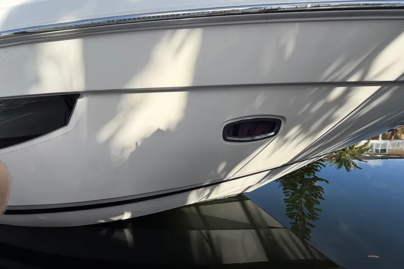 Slide: The Image of 2018 Regal 53 Sport Coupe yacht reflecting on calm water. - 19