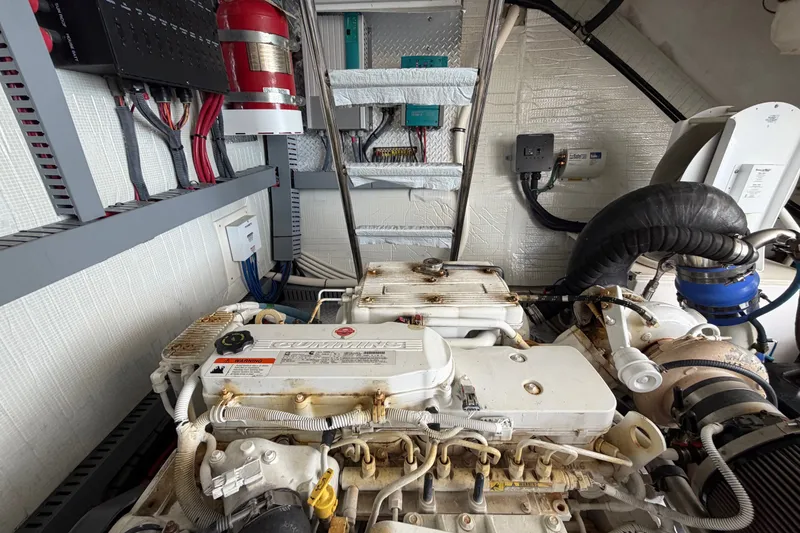 Slide: The Image of Engine room of 2018 Regal 53 Sport Coupe with Cummins engine and fire suppression system. - 52