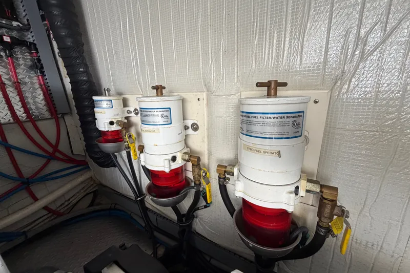 Slide: The Image of Diesel fuel filter system in 2018 Regal 53 Sport Coupe engine room. - 58